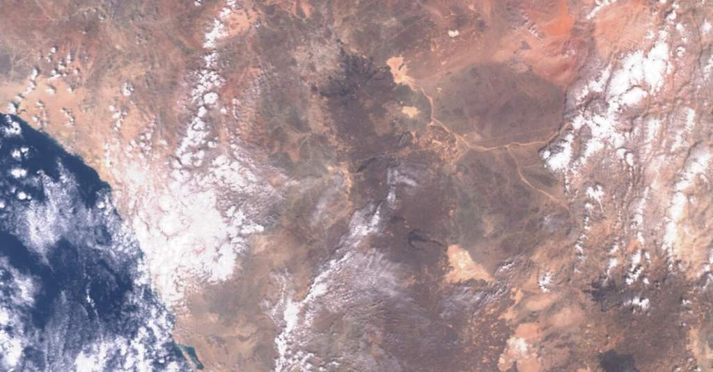 Industrial infrastructure of the Saudi East-West oil pipeline running across the Arabian Peninsula towards Red Sea export terminals.