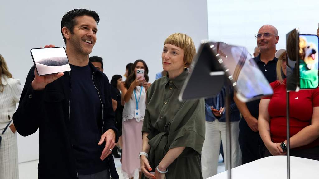 Apple's new foldable smartphone displayed on a sleek presentation stage during the official product launch event.