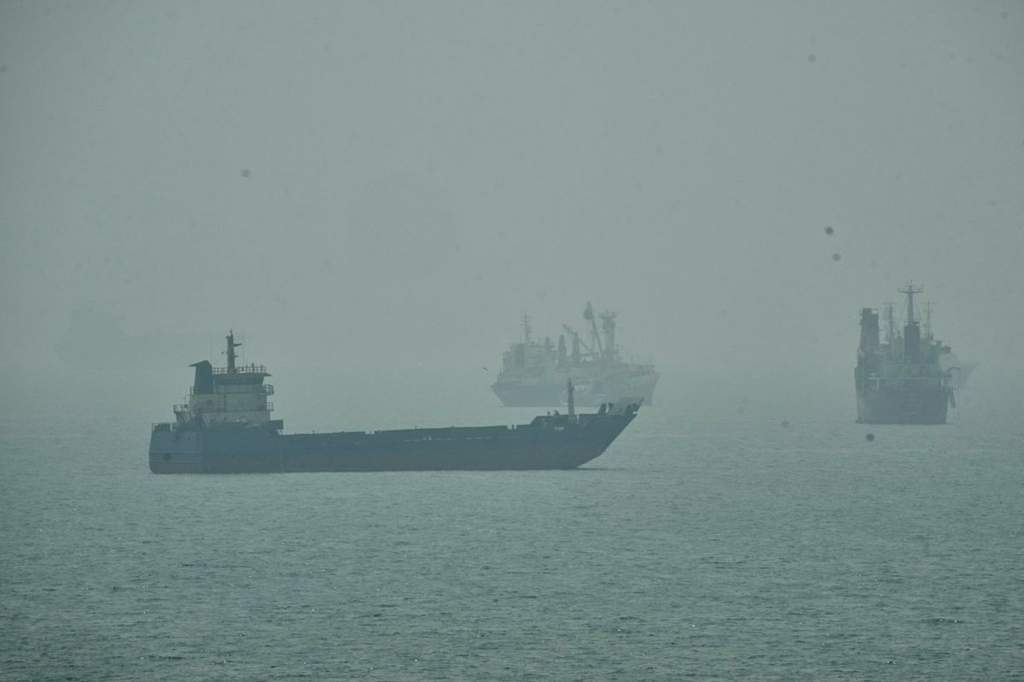 A commercial ship damaged following a projectile strike near the Strait of Hormuz in the Persian Gulf.