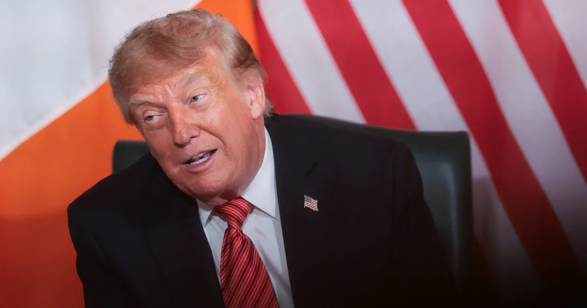 President Donald Trump speaking at a podium during a press conference in Dublin, Ireland, alongside Irish Prime Minister Micheál Martin.