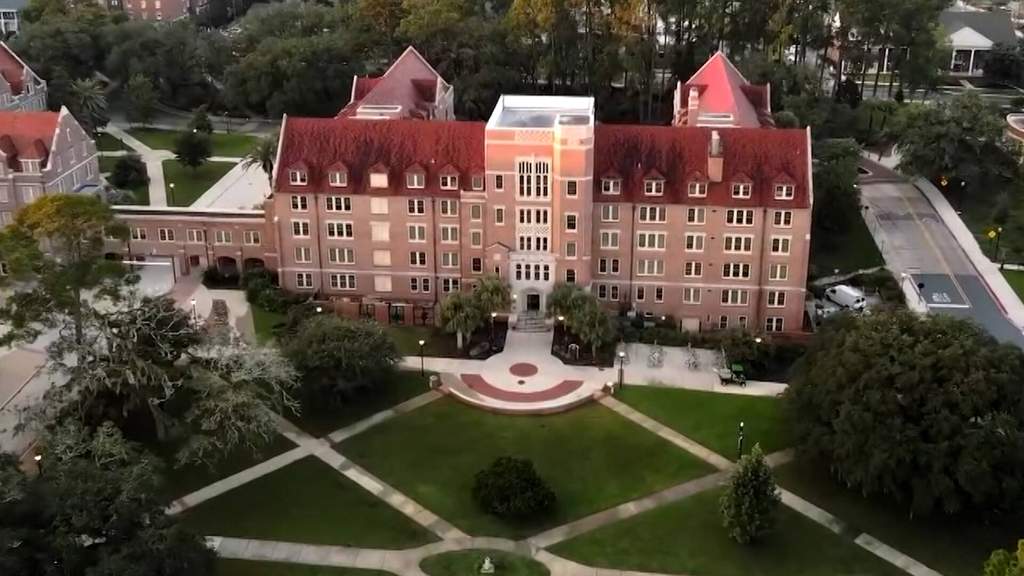 A view of a public university campus in Florida showing academic buildings and walkways under clear daytime skies.