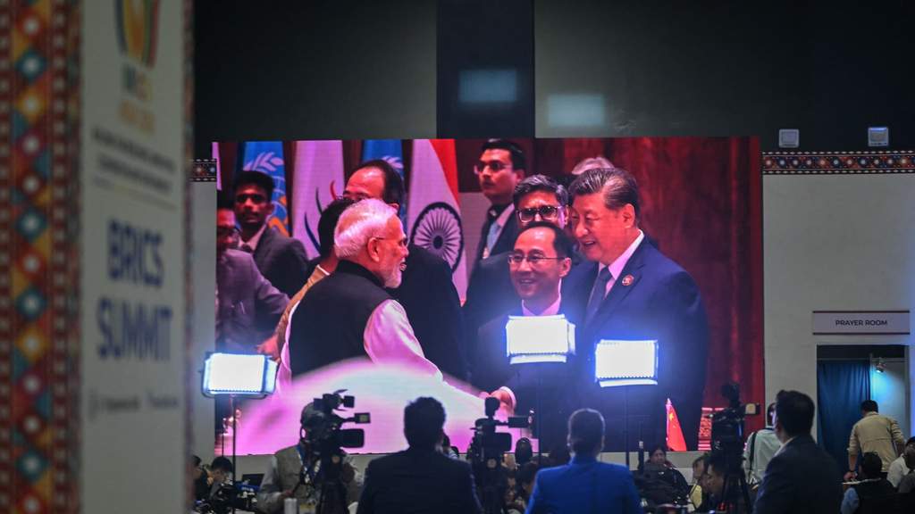 Indian Prime Minister Narendra Modi and Chinese President Xi Jinping shaking hands during their bilateral meeting on the sidelines of the BRICS Summit.