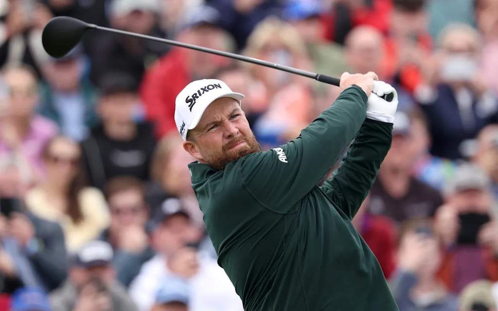 Irish professional golfer Shane Lowry on the course during a competitive tournament round, focusing on his swing.