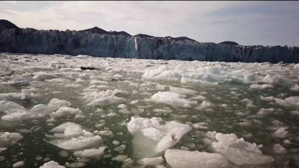 A striking visual representation of melting permafrost and raging wildfires contributing to accelerated global climate heating.