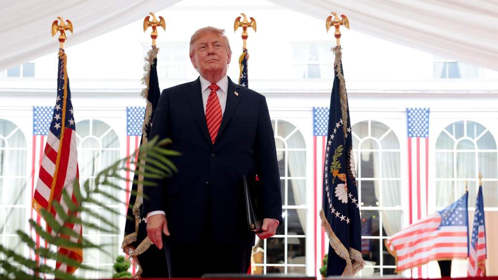 President Donald Trump speaking to reporters during a trip abroad, addressing international security matters and global energy markets.