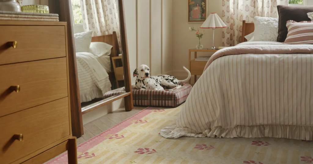 A cozy living room featuring a stylish Ruggable x Anthropologie tufted washable rug with soft sculptural patterns and neutral tones.