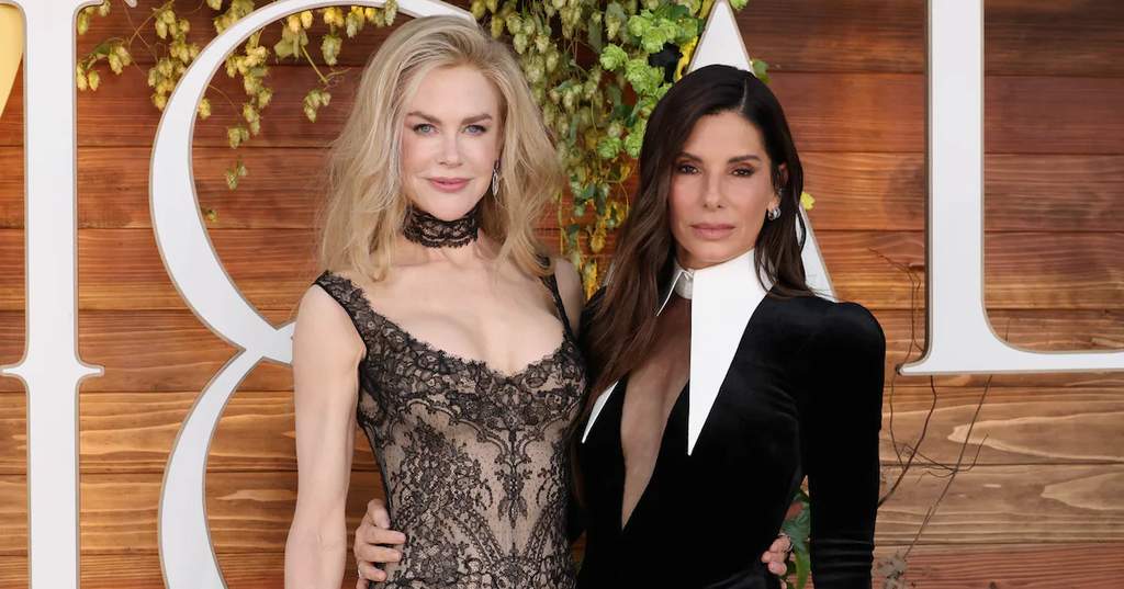 Sandra Bullock and Nicole Kidman smiling and sharing a lighthearted moment together during a promotional interview event for Practical Magic 2.