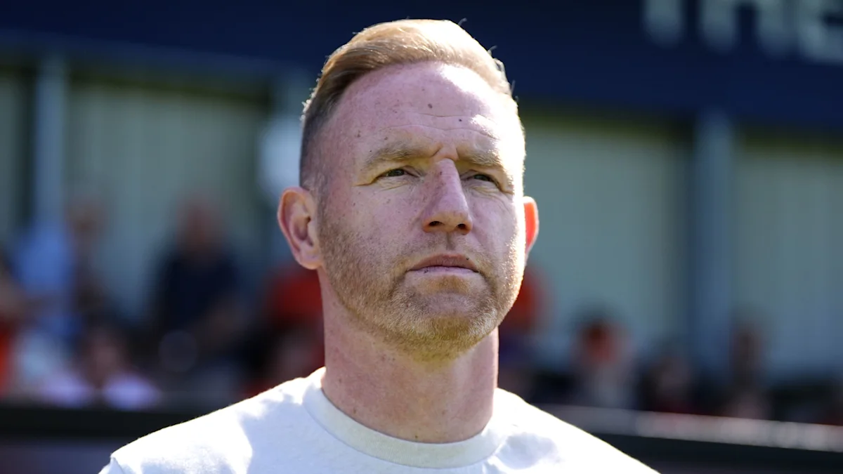 Shrewsbury Town manager Gavin Cowan coaching from the sideline during a league fixture.