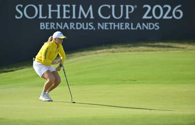 Team Europe golfers celebrating a successful putt during the Solheim Cup tournament.