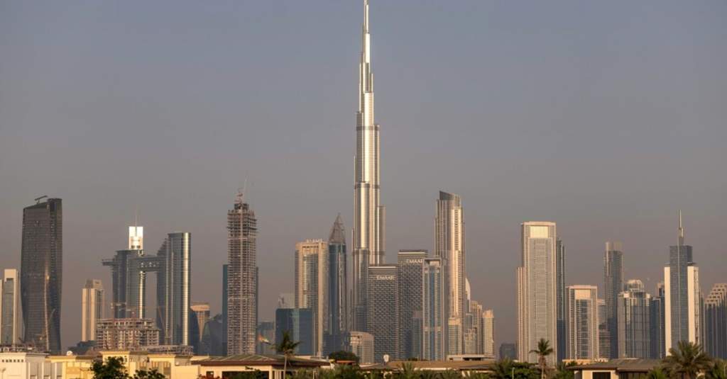 Traditional market stalls in old Dubai filled with various imported goods and spices from across the Gulf region.